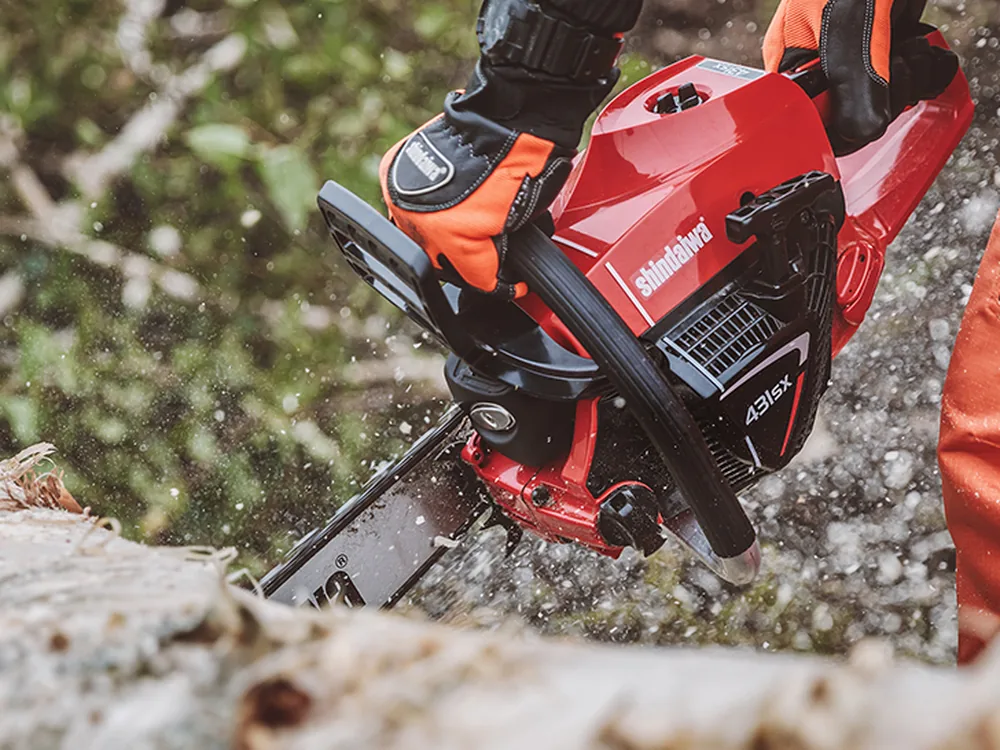 Petrol chainsaw in use